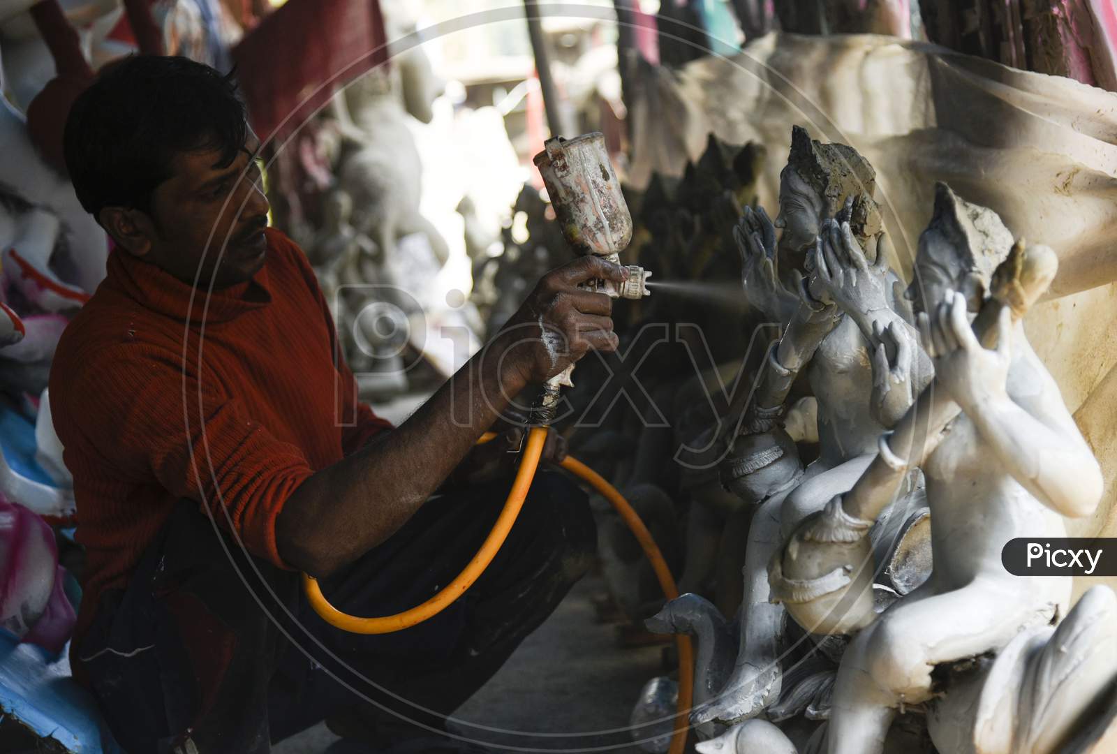 Preparation Of Sawaswati Puja , An Artist Working In Workshop Of Saraswati Idols Ahead Of Saraswati Puja, In Guwahati