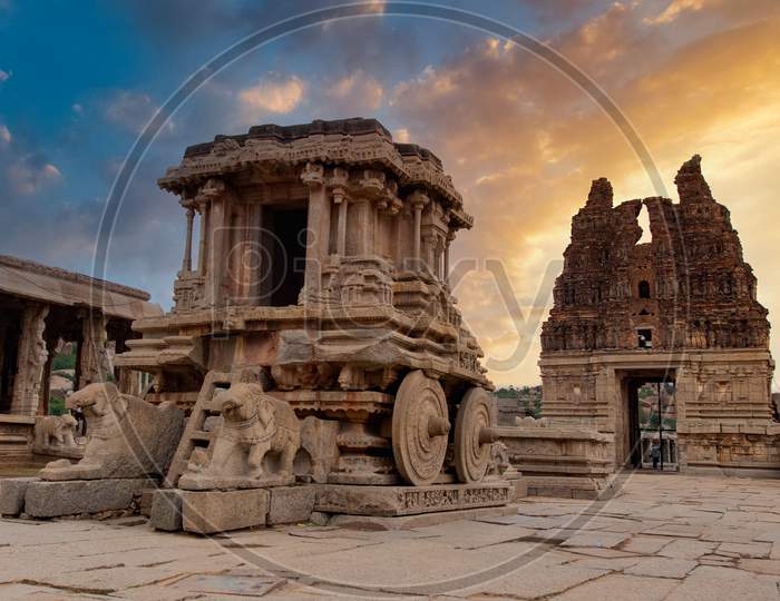 Stone Chariot In Vittala Temple  With Sunset Golden Clouds in Background