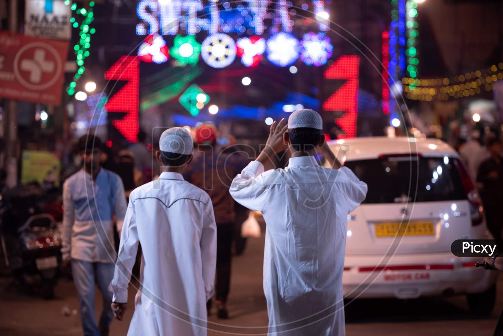 A Muslim Boy Wearing A Namaz Cap And Waling On a Street