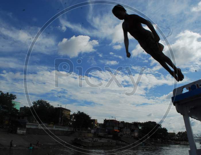 Indian Rural Village Boys Jumping In River And Swimming