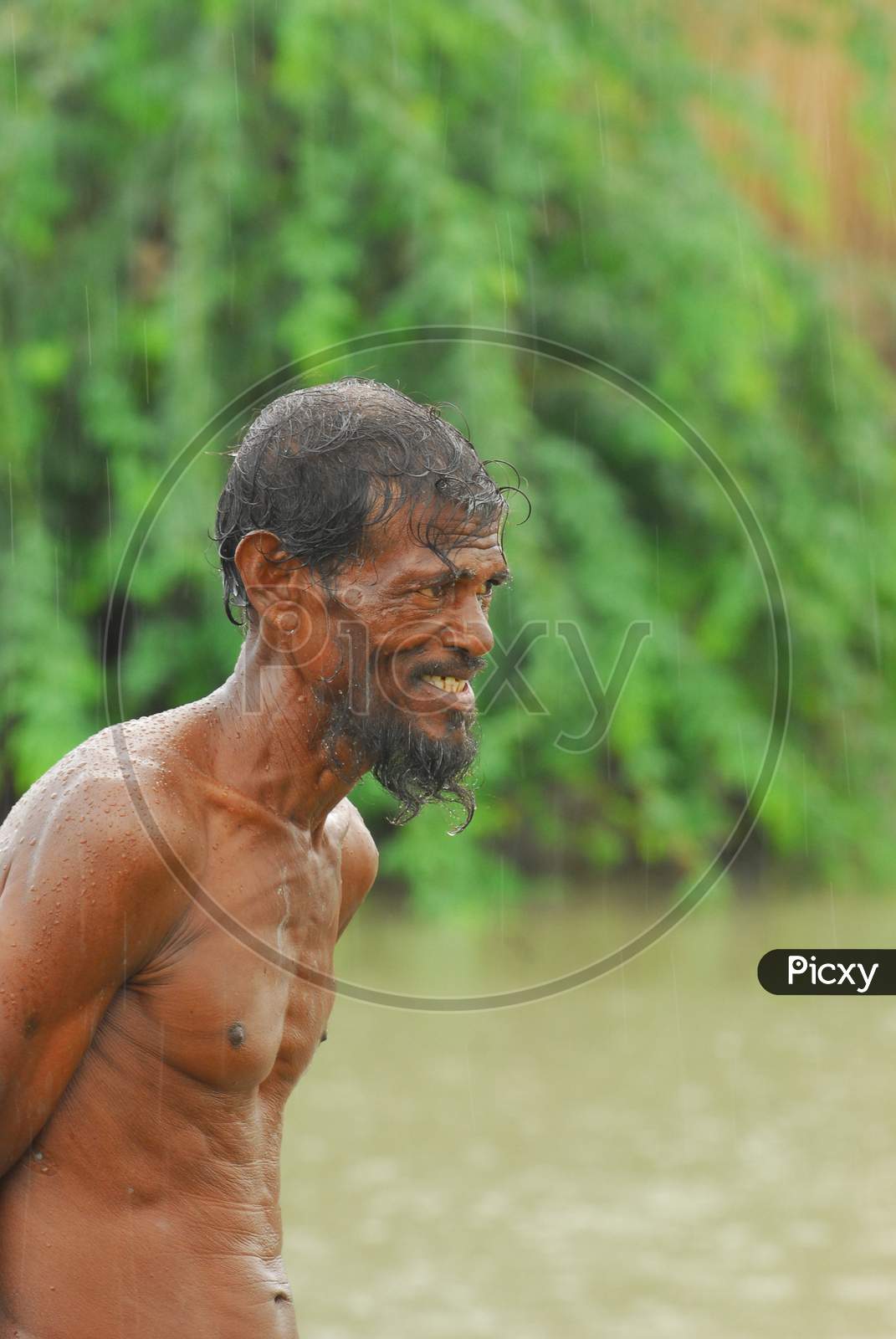 Indian bare chested man smiling