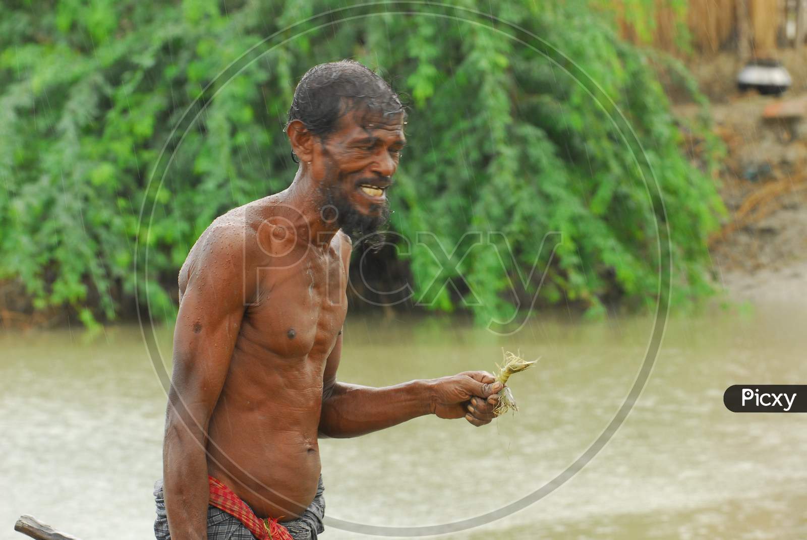 Indian fisherman with a shrimp