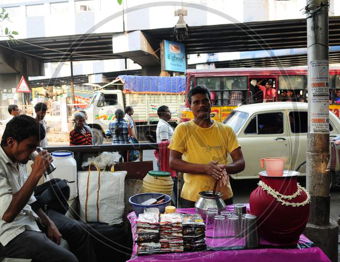 Indian Man drinking buttermilk in the street market