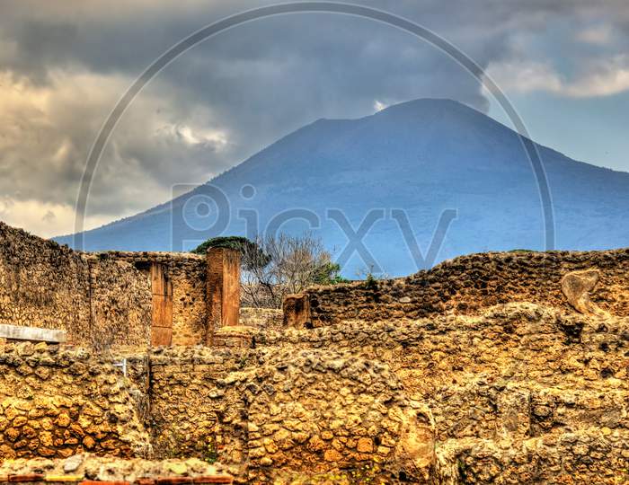 Ruins Of Pompeii With Mount Vesuvius In The Background