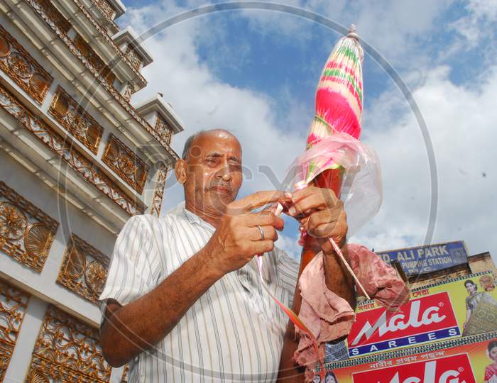 Indian man blending a shape with candy