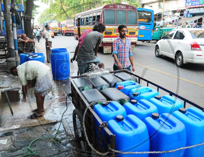Empty plastic water tins for filling drinking water