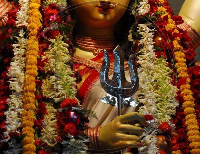 Indian Hindu Goddess statue with flowers