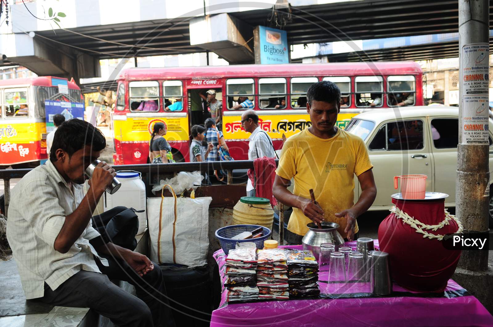 Indian street vendor making lassi