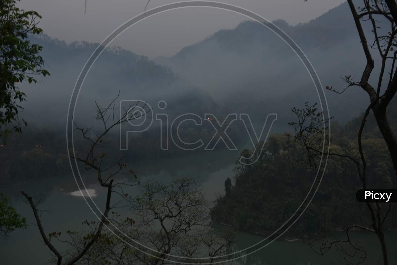 View of mountains covered in fog