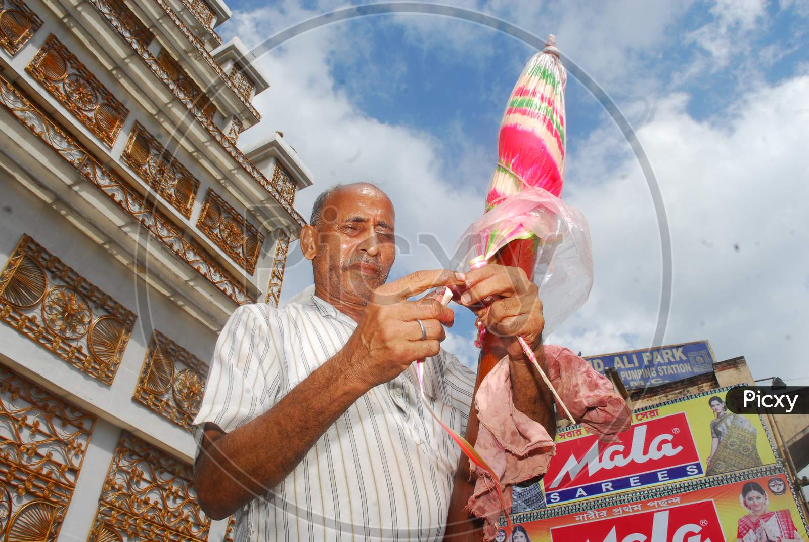 Indian man blending a shape with candy
