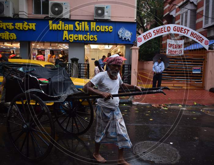 Indian Man pulling rickshaw