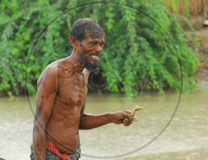 Indian fisherman with a shrimp