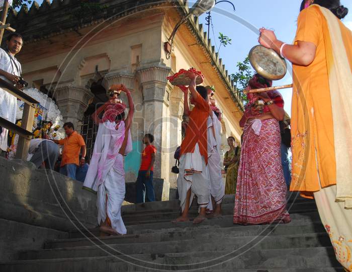 Indian little boys entering a temple