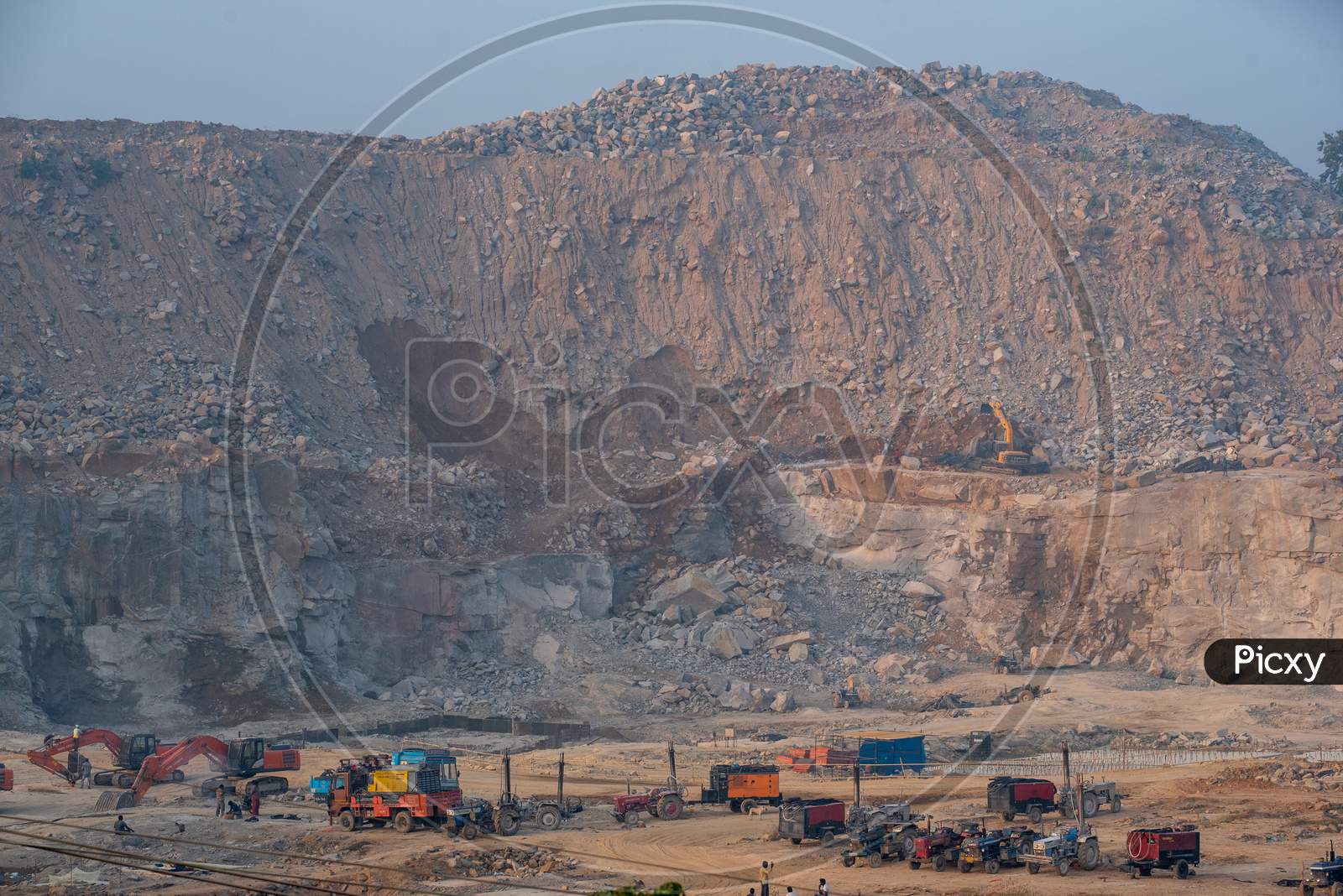 Excavation Site For Construction In The Middle Of an Urban City With Heavy Trucks And JCB  Working