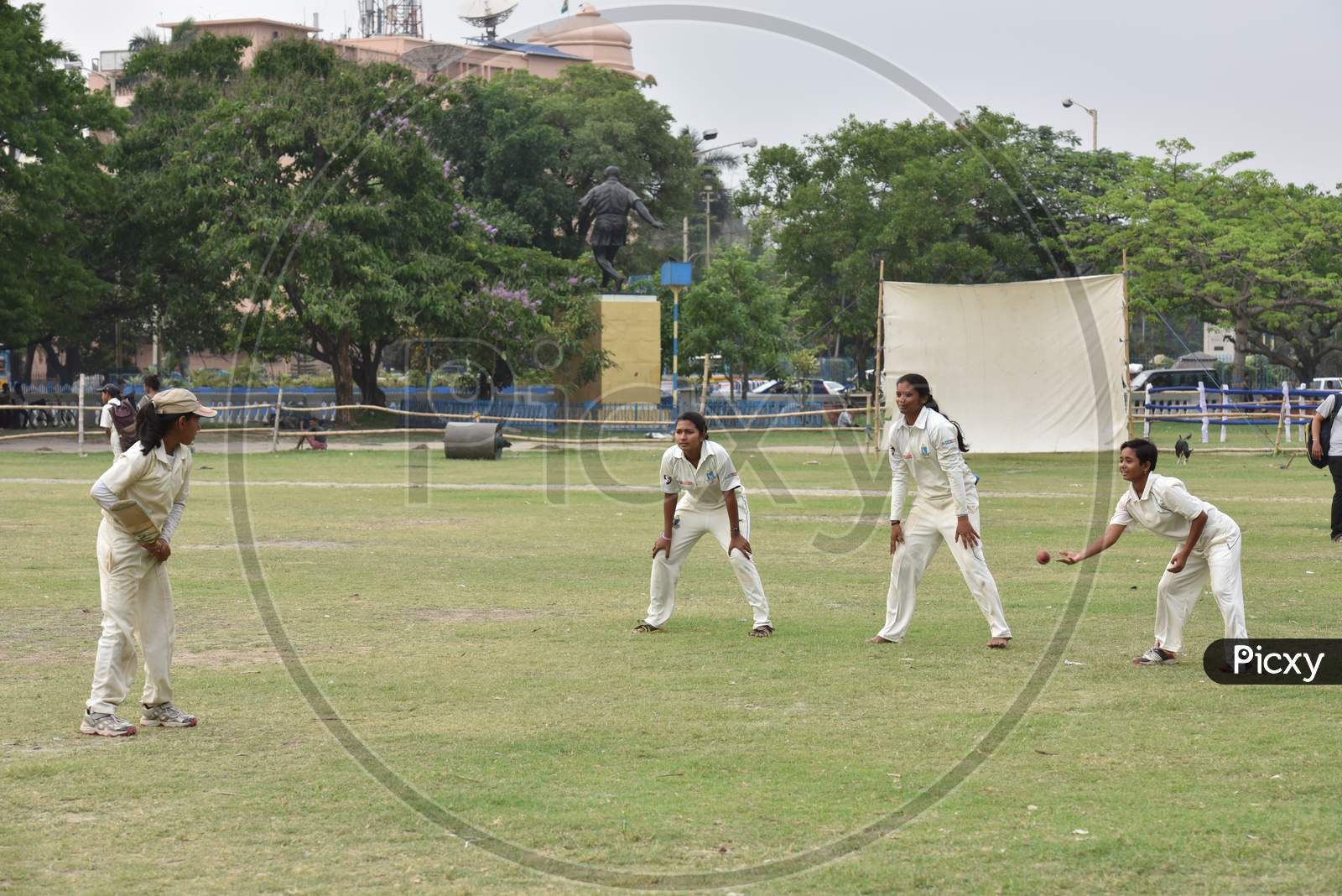 School girls practicing Cricket