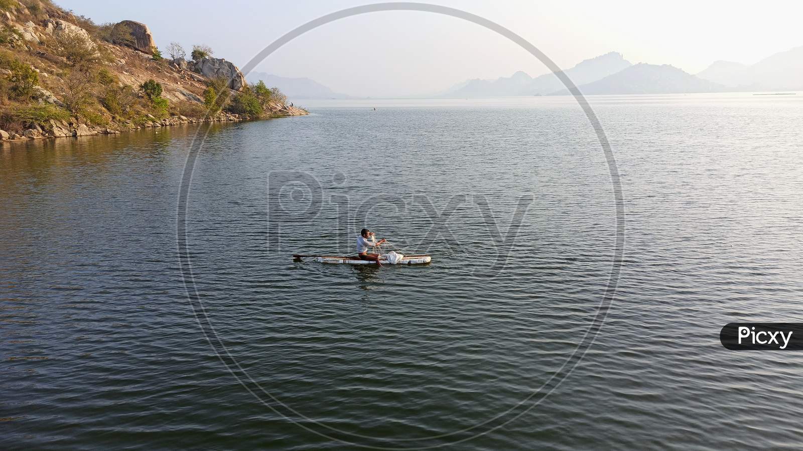 Fisherman at Koilsagar Project Reservoir Mahabubnagar Telangana India