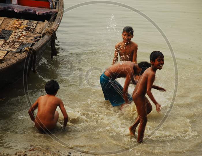 Group of Indian Children playing in the river