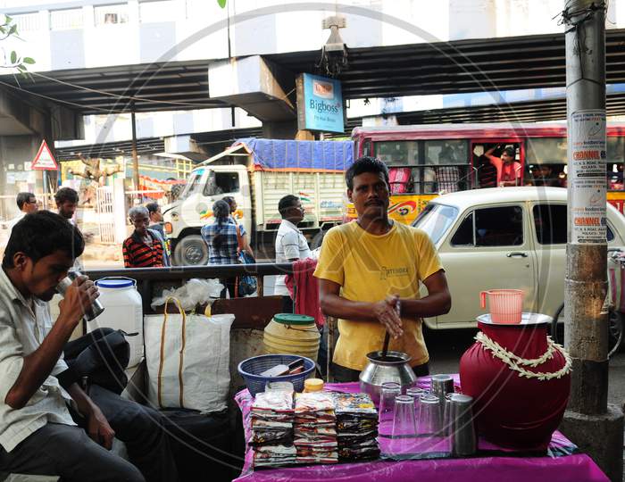 Indian man drinking Lassi in the street