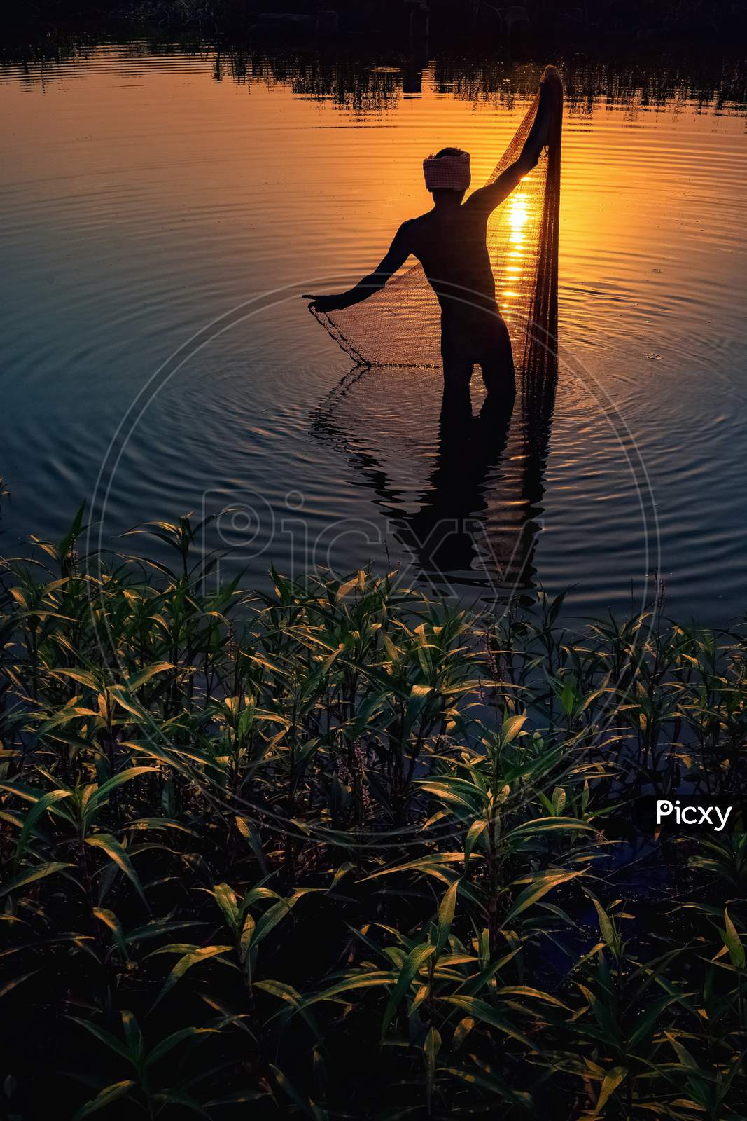 Fisherman during sunset.