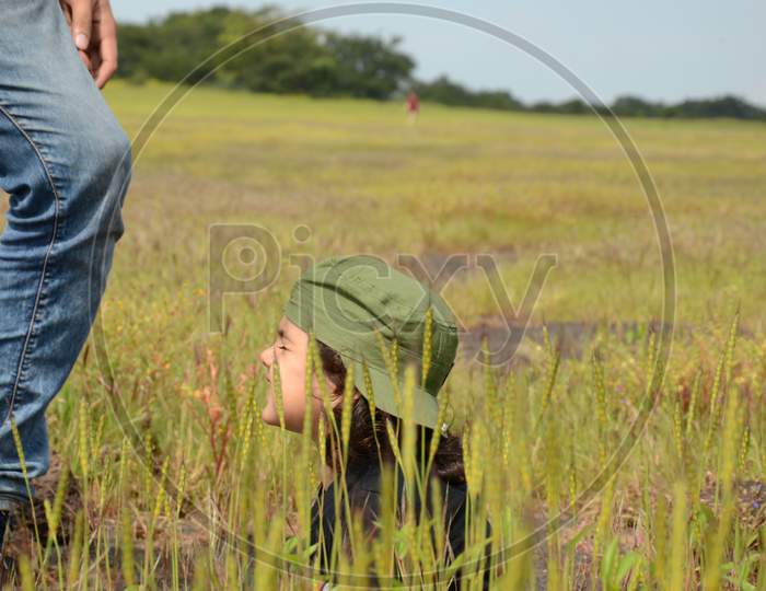 A Young Child In an Grass Fields