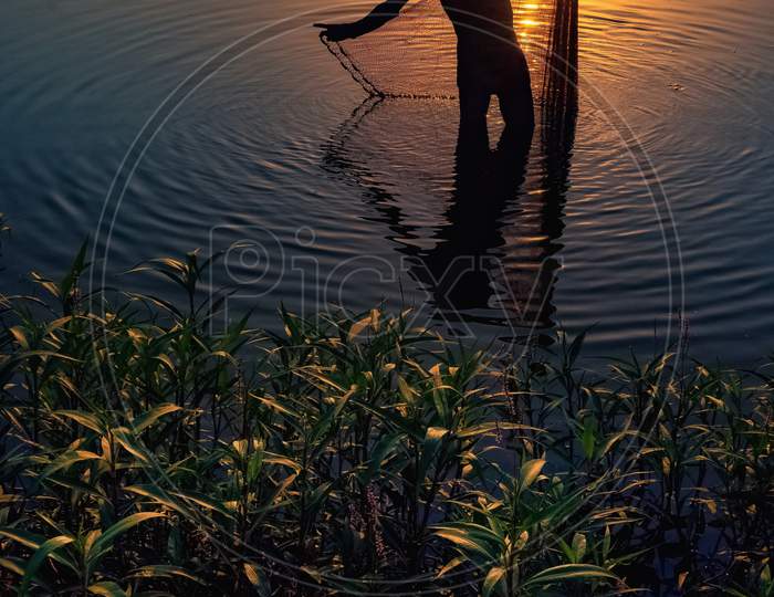 Fisherman during sunset.