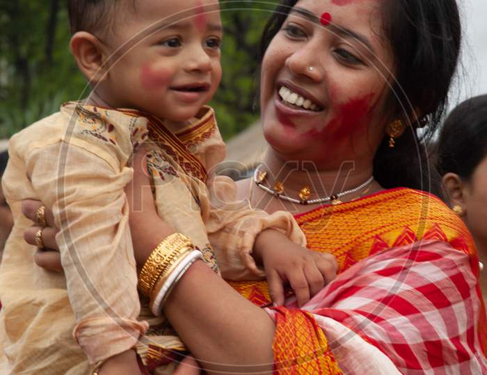 Indian Mother smiling along with her baby boy
