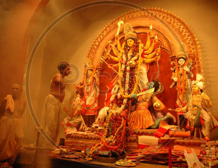 A Decorated Durga Maata Statue with garlands inside the temple