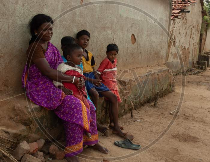A Woman With Children At an Rural Indian Village