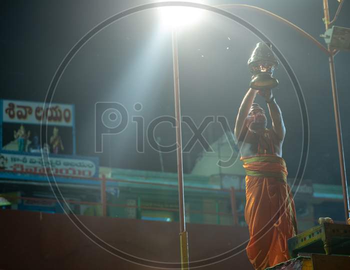 A priest offering Haarathi to Godavari River at Rajahmundry