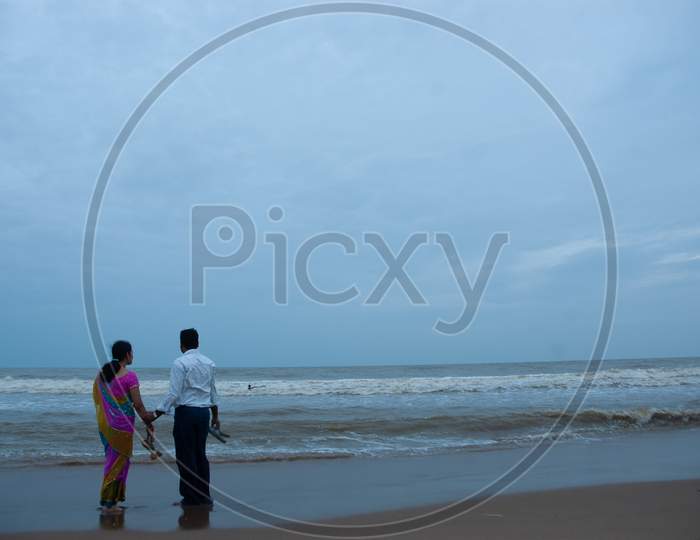 Indian Middle aged couple by the beach