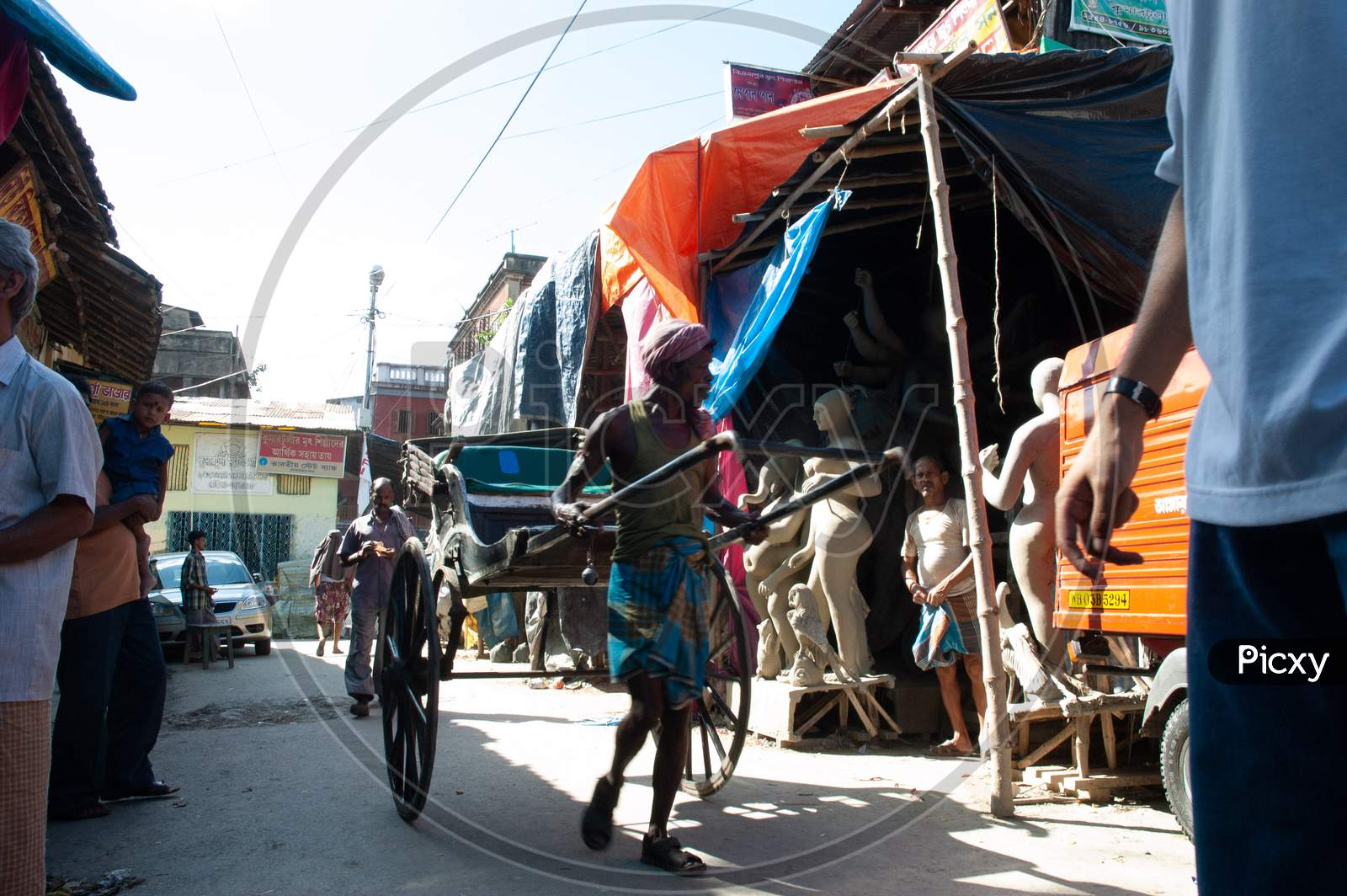 A Cart Puller  On The Streets Of Kumortuli , Kolkata