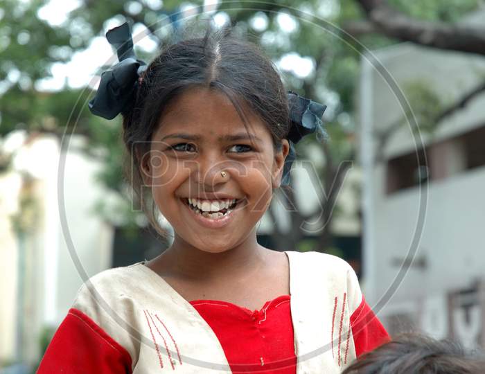 Indian Young Girl Child With a Smile Expression on Streets Of  Kolkata