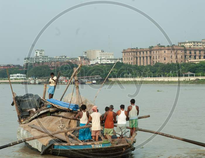 Indian Local fishermen rowing the boat