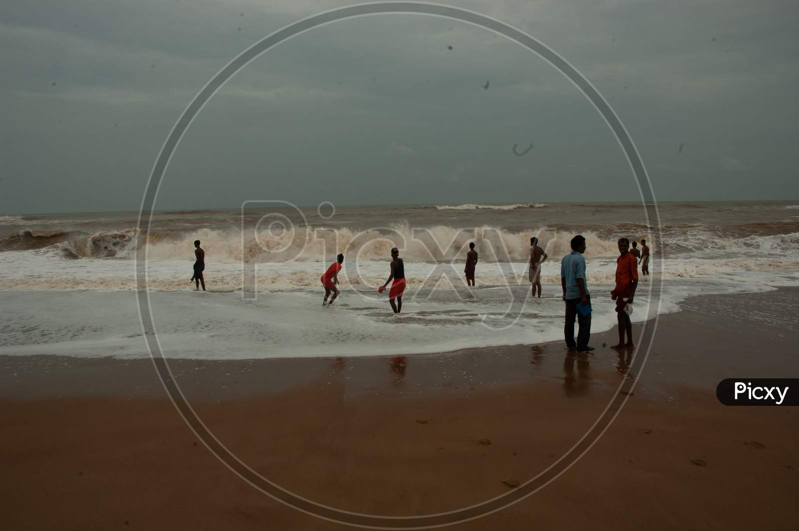 Group of Indian boys having fun by the beach