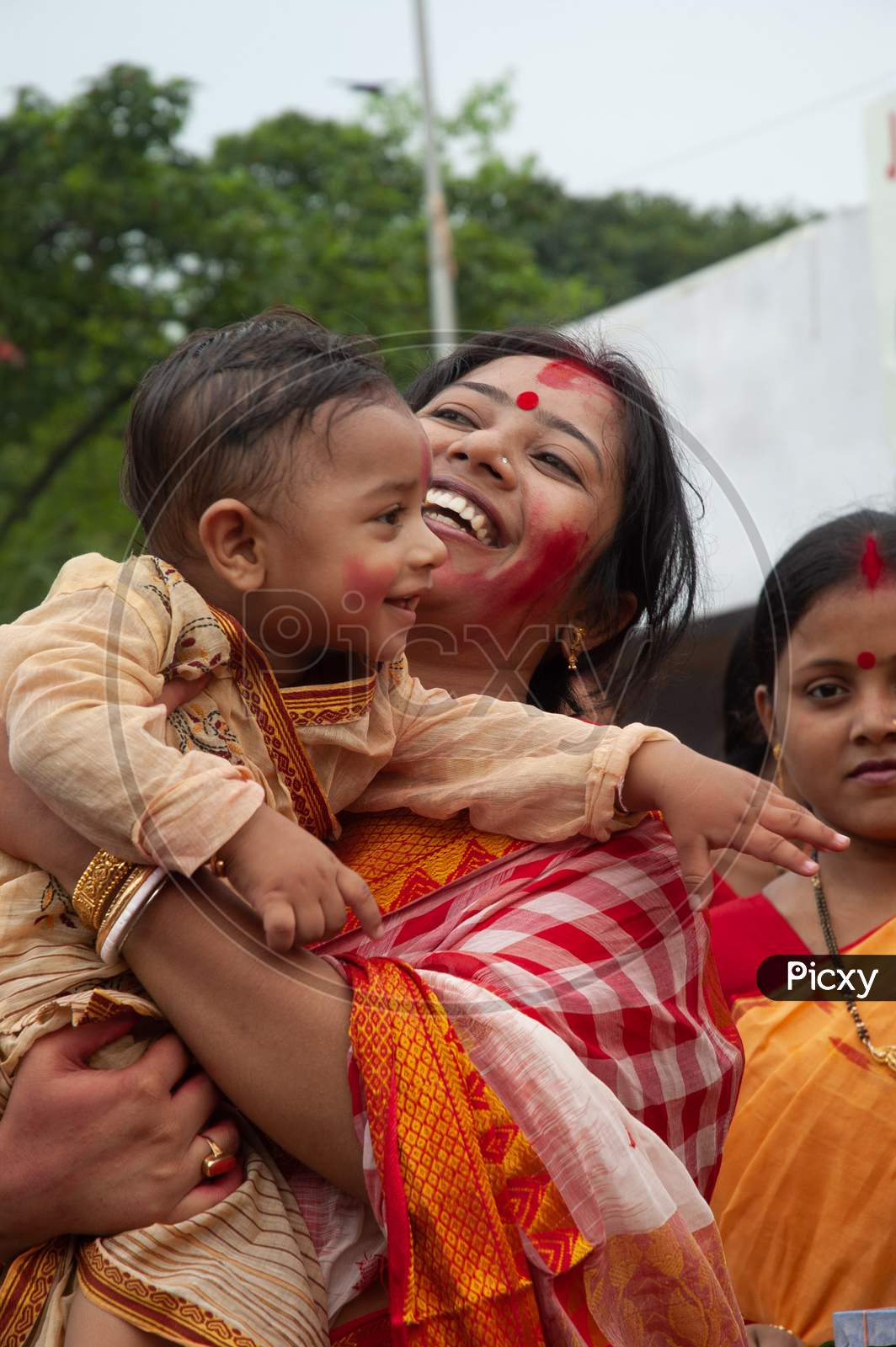 Indian Mother with her baby boy during Durga Puja