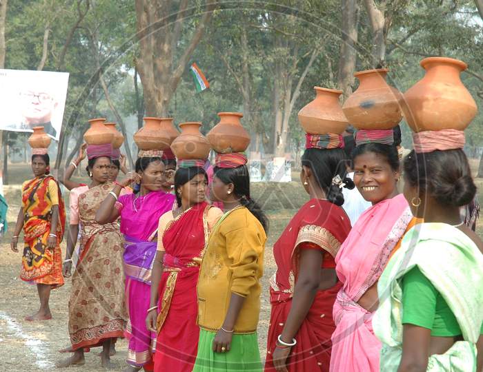 Indian Women holding pots on their heads