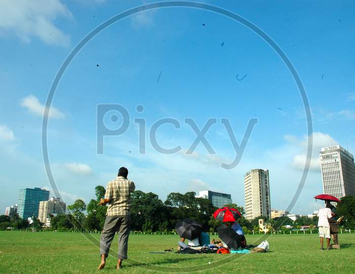 People Sitting in Maidan Or Lawn Garden In Kolkata
