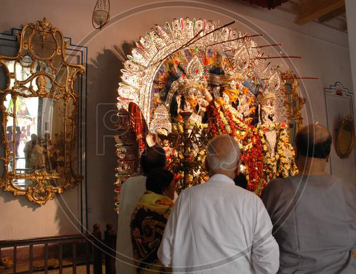 Devotees worshiping Devi Mata during Pooja