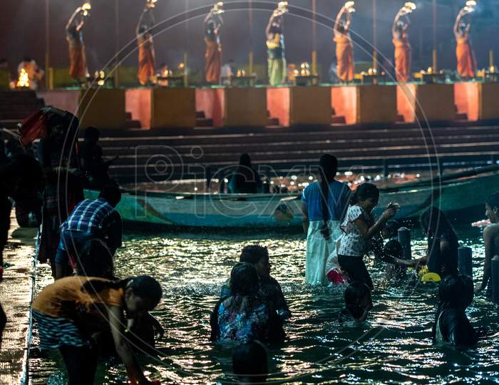 People bath in River Godavari during Harathi is being offered