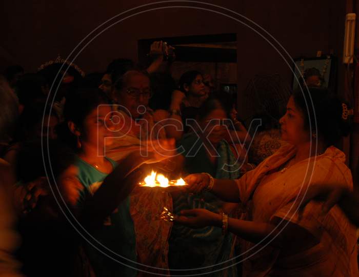 Indian Devotees receiving sacred flame