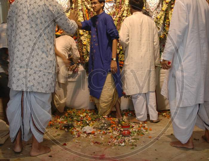 Devotees offering prayers during Durga Pooja