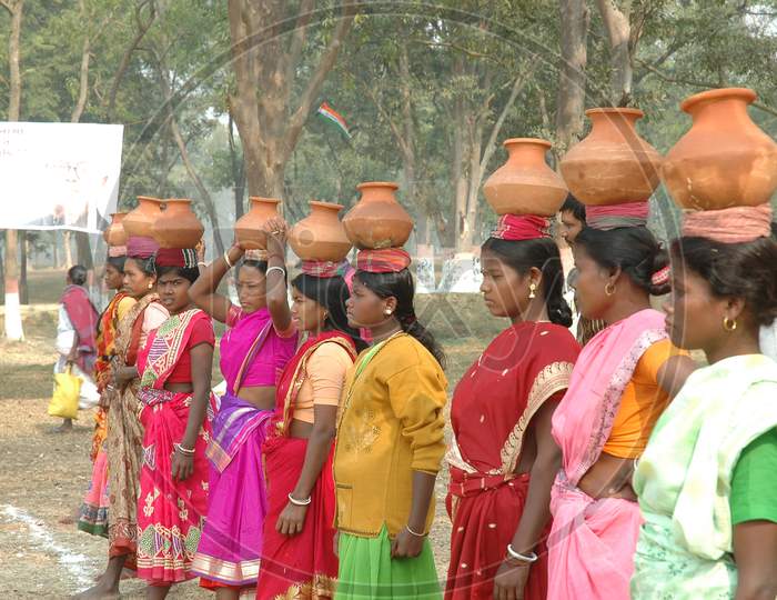 Indian women with pots on their heads