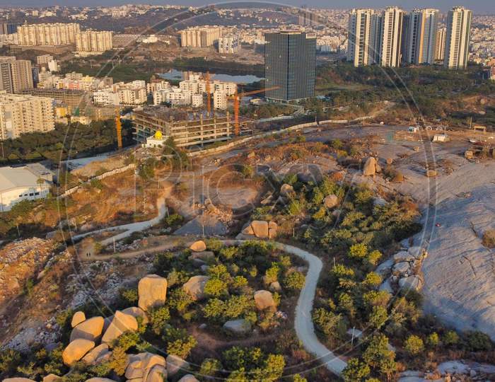 Aerial  View Of Rock Hills And high Rise Corporate buildings  At Kajaguda Hills