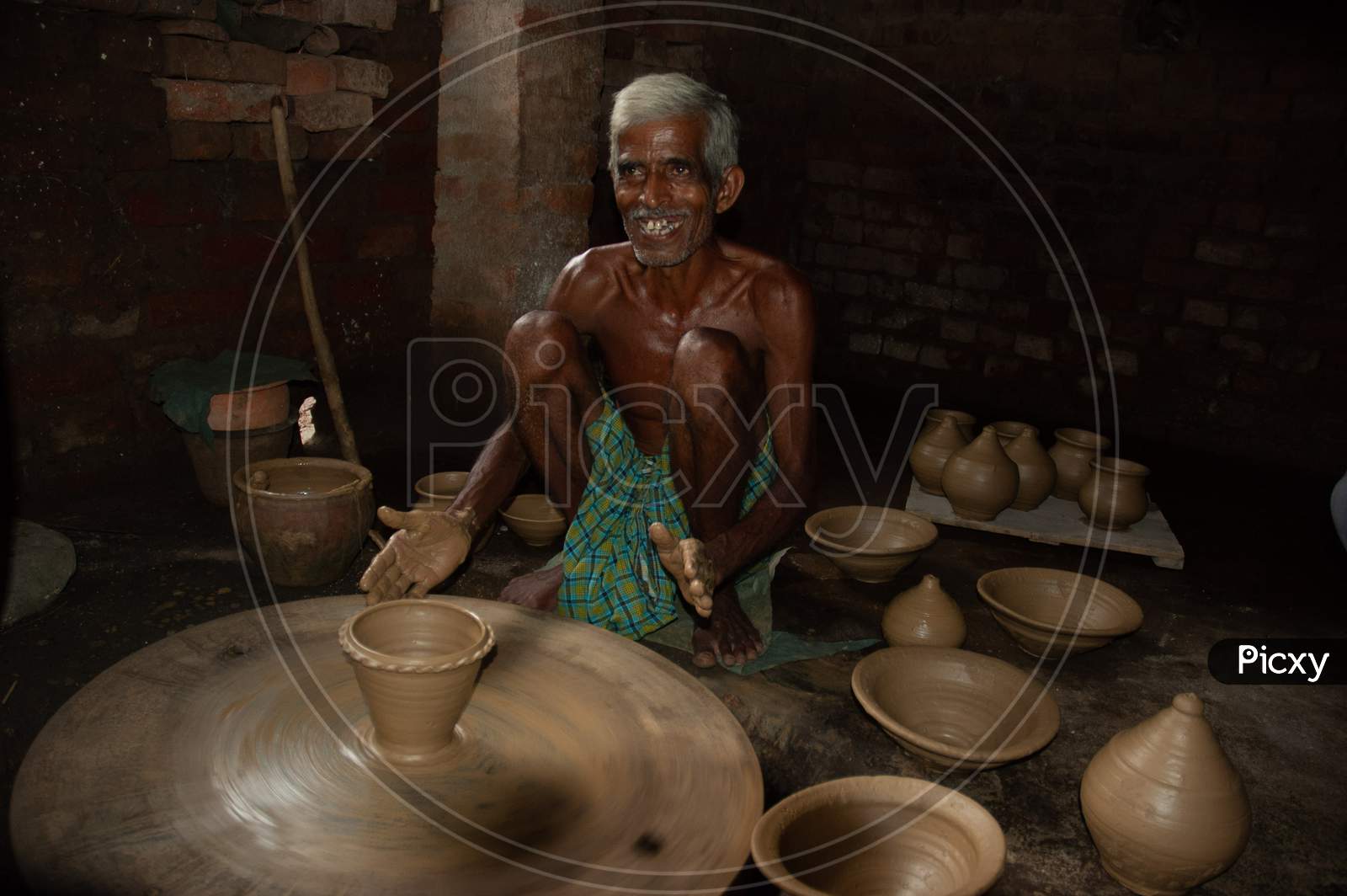 A Potter Making Clay Pots In an Rural Village