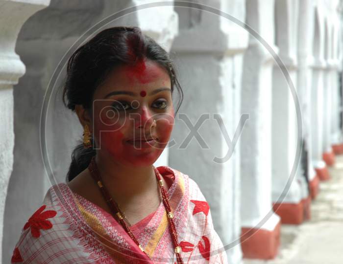 Indian Female Devotee with face paint during durga puja