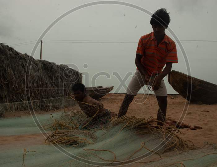 Indian Local fishermen arranging the fishing net