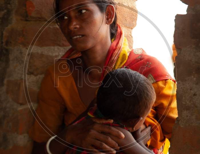 Indian Mother Feeding Baby At a Rural Village