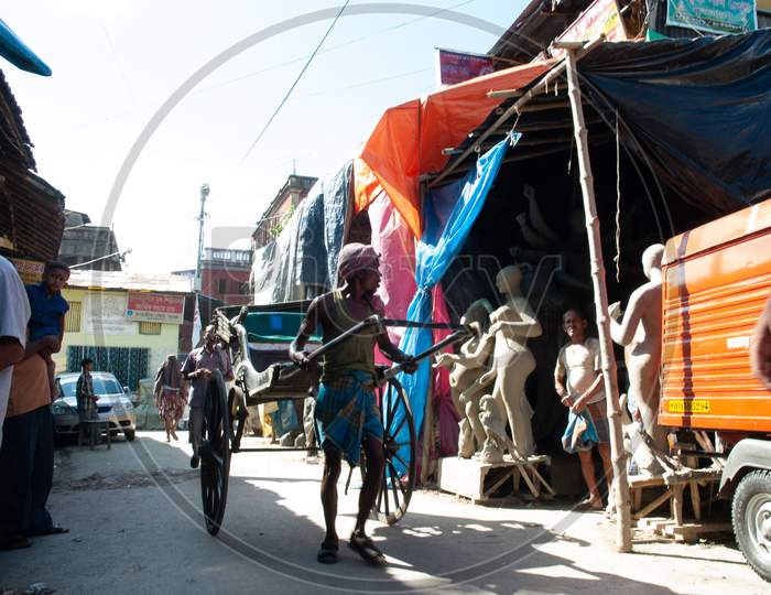 A Cart Puller  On The Streets Of Kumortuli , Kolkata