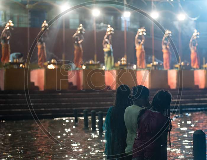 Devotees watch Godavari haarathi as they take bath in River Godavari at Pushkar Ghat