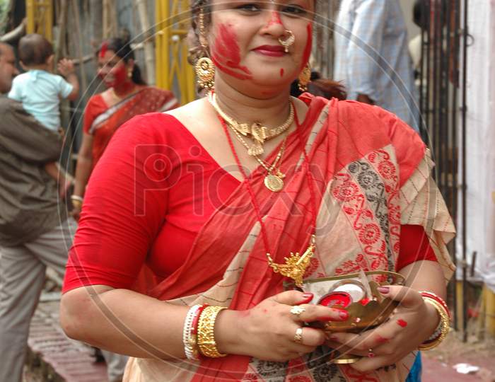 Indian Traditional Woman holding Bindi Powder during Durga Puja